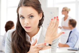 business and time management concept - businesswoman pointing at