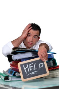 bigstock-Office-worker-with-a-sign-aski-30786518