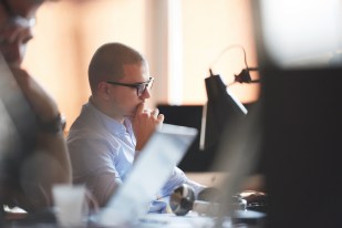 startup business, software developer working on computer at mode