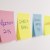Sticky notes of to do list on wall.