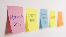 Sticky notes of to do list on wall.