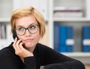 Young Businesswoman Listening To A Mobile Call